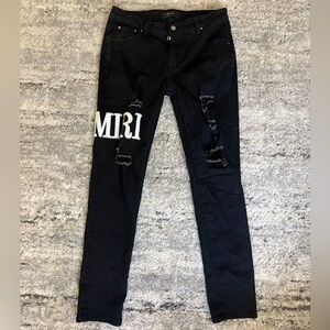 AMIRI Black Jeans with Subtle Distressing